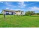 House exterior showcasing a fenced backyard and well-maintained lawn at 8430 Acorn Blvd, Punta Gorda, FL 33982