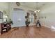 Spacious living room featuring hardwood floors and a view to the entryway at 8430 Acorn Blvd, Punta Gorda, FL 33982