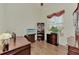 Home office with built-in shelving and hardwood floors at 8430 Acorn Blvd, Punta Gorda, FL 33982