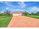 Two-car garage and well-manicured lawn enhance curb appeal at 8430 Acorn Blvd, Punta Gorda, FL 33982