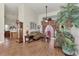 Living room with hardwood floors, a couch, and a view into the kitchen at 8430 Acorn Blvd, Punta Gorda, FL 33982