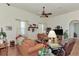 Bright living room with hardwood floors, comfortable seating, and large windows at 8430 Acorn Blvd, Punta Gorda, FL 33982