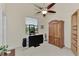 Comfortable bedroom with built-in shelving, a ceiling fan, and ample space at 8430 Acorn Blvd, Punta Gorda, FL 33982