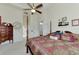 Main bedroom with a large bed and ensuite bathroom access at 8430 Acorn Blvd, Punta Gorda, FL 33982