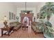 Living area with hardwood floors, a couch, and a view to the backyard at 8430 Acorn Blvd, Punta Gorda, FL 33982