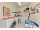 Laundry room with washer, dryer, and ample storage at 8430 Acorn Blvd, Punta Gorda, FL 33982