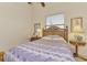 Charming bedroom with a comfortable bed, nightstand, and decorative accents at 8430 Acorn Blvd, Punta Gorda, FL 33982