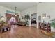 Relaxing living room with hardwood floors, a couch, and access to the main bedroom at 8430 Acorn Blvd, Punta Gorda, FL 33982