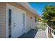 White door and deck on tan house exterior at 24261 Captain Kidd Blvd, Punta Gorda, FL 33955