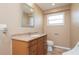 Bathroom featuring wood vanity and a toilet at 24261 Captain Kidd Blvd, Punta Gorda, FL 33955