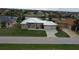 Single Gathering home situated on a tree lined street with a view of a canal at 2325 Padre Island Dr, Punta Gorda, FL 33950
