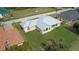Single-story home, metal roof, screened patio, and large backyard at 2325 Padre Island Dr, Punta Gorda, FL 33950