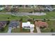 Aerial view of a single-Gathering home with a large backyard and a golf course nearby at 2325 Padre Island Dr, Punta Gorda, FL 33950