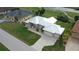 Single-story house with metal roof, attached garage, and large yard at 2325 Padre Island Dr, Punta Gorda, FL 33950