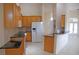 Open kitchen boasts wood cabinets, granite countertops, and breakfast bar at 2325 Padre Island Dr, Punta Gorda, FL 33950