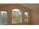 Living area with vaulted ceiling and multiple windows with blinds at 2325 Padre Island Dr, Punta Gorda, FL 33950