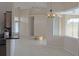 Open living and dining area with tile floors and large windows at 2325 Padre Island Dr, Punta Gorda, FL 33950