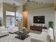 Bright living room featuring a staged sitting area with modern furniture at 2325 Padre Island Dr, Punta Gorda, FL 33950