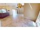 Living area with tile floors and view to pool area at 27200 San Marino Dr, Punta Gorda, FL 33983