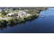 Aerial view showcasing community amenities including a waterfront park and boat docks at 27200 San Marino Dr, Punta Gorda, FL 33983