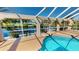 Enclosed pool and spa with canal view at 27200 San Marino Dr, Punta Gorda, FL 33983