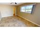 Bedroom with tile floor, ceiling fan, and water view at 27200 San Marino Dr, Punta Gorda, FL 33983