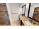 Bathroom with double vanity, granite countertop, and tile flooring at 27200 San Marino Dr, Punta Gorda, FL 33983