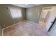 Bright bedroom with tile flooring and access to hallway at 27200 San Marino Dr, Punta Gorda, FL 33983