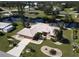 Aerial view of single-Gathering home with canal views and lush landscaping at 27200 San Marino Dr, Punta Gorda, FL 33983