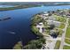 Aerial view of waterfront community with tennis courts, marina, and clubhouse at 27200 San Marino Dr, Punta Gorda, FL 33983