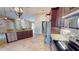 Modern kitchen with granite countertops and island at 27200 San Marino Dr, Punta Gorda, FL 33983