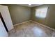 Bedroom with tile floors and ceiling fan at 27200 San Marino Dr, Punta Gorda, FL 33983