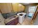 Laundry room with washer, dryer, sink, and cabinets at 27200 San Marino Dr, Punta Gorda, FL 33983