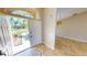 Bright entryway with tile flooring and view of the front yard at 27200 San Marino Dr, Punta Gorda, FL 33983