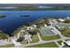 Aerial view of waterfront park with tennis court at 27200 San Marino Dr, Punta Gorda, FL 33983