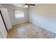 Bedroom with tile floors and ceiling fan at 27200 San Marino Dr, Punta Gorda, FL 33983