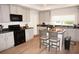 Modern kitchen with stainless steel appliances and breakfast bar at 26332 Barranquilla Ave, Punta Gorda, FL 33983
