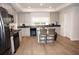 Modern kitchen with gray cabinets and an island at 26332 Barranquilla Ave, Punta Gorda, FL 33983