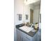 Vanity with gray cabinets and a modern sink at 26332 Barranquilla Ave, Punta Gorda, FL 33983