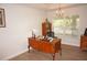Bright home office features built-in shelving and large window at 26332 Barranquilla Ave, Punta Gorda, FL 33983