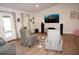 Living room with a large TV and comfortable seating at 26332 Barranquilla Ave, Punta Gorda, FL 33983