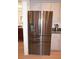 Modern kitchen with stainless steel refrigerator at 26332 Barranquilla Ave, Punta Gorda, FL 33983