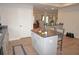 Modern kitchen with island and access to other rooms at 26332 Barranquilla Ave, Punta Gorda, FL 33983