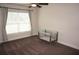 Bright bedroom with window coverings, ceiling fan, and carpeted floor at 26332 Barranquilla Ave, Punta Gorda, FL 33983