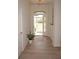 Bright and airy entryway with wood-look floors at 26332 Barranquilla Ave, Punta Gorda, FL 33983