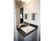 Vanity with gray cabinets and a modern sink at 26332 Barranquilla Ave, Punta Gorda, FL 33983