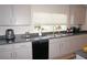 Modern kitchen with stainless steel appliances and sink at 26332 Barranquilla Ave, Punta Gorda, FL 33983