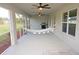 Relaxing screened porch with ceiling fans and hammock at 26332 Barranquilla Ave, Punta Gorda, FL 33983