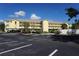Condo building with parking and landscaping at 175 Kings Hwy # 923, Punta Gorda, FL 33983