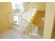 White staircase with metal railings leading to upper levels of the building at 175 Kings Hwy # 923, Punta Gorda, FL 33983